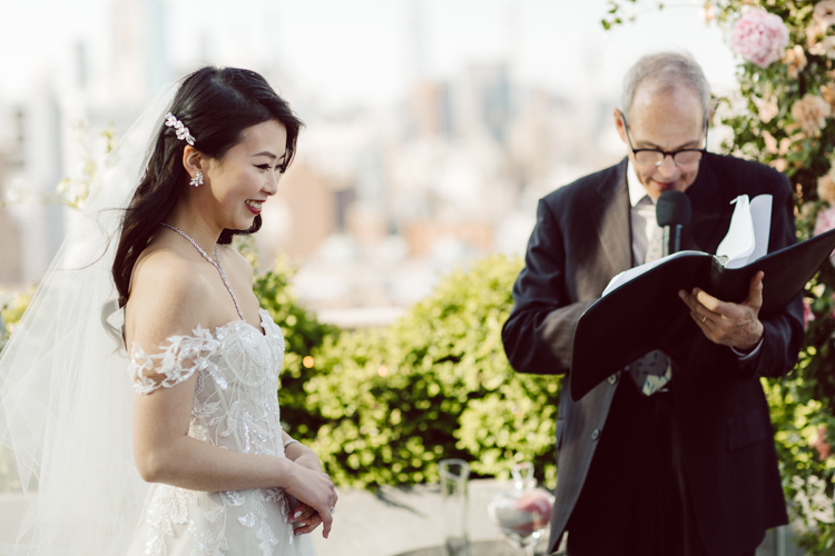 Public Hotel NYC spring rooftop wedding with Stella and Peter. NYC began to loosen COVID restrictions so events and weddings were finally allowed. Stella and Peter were able to keep their original wedding date, but unfortunately Stella's parents couldn't make it to the wedding due to COVID travel restrictions. Stella and Peter's wedding took place on 17th floor with rooftop access at the Public Hotel. Their wedding ceremony was on the rooftop, as well as their first look and some photos then we wandered around the hotel and took some epic photos at the pent house and escalator. Public Hotel NYC was so fun to photograph and I had the coolest, the most chill couple to work with. Stella and Peter's epic wedding at Public Hotel NYC photographed by Karis | Hey Karis.